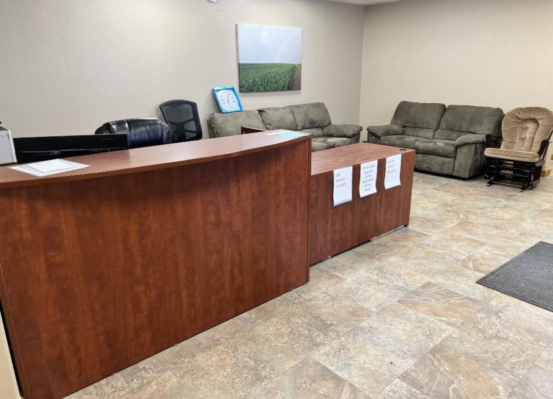 Lot Of Reception Area. With L shaped desk, computer, monitor, keyboard, label maker, chair, shredder