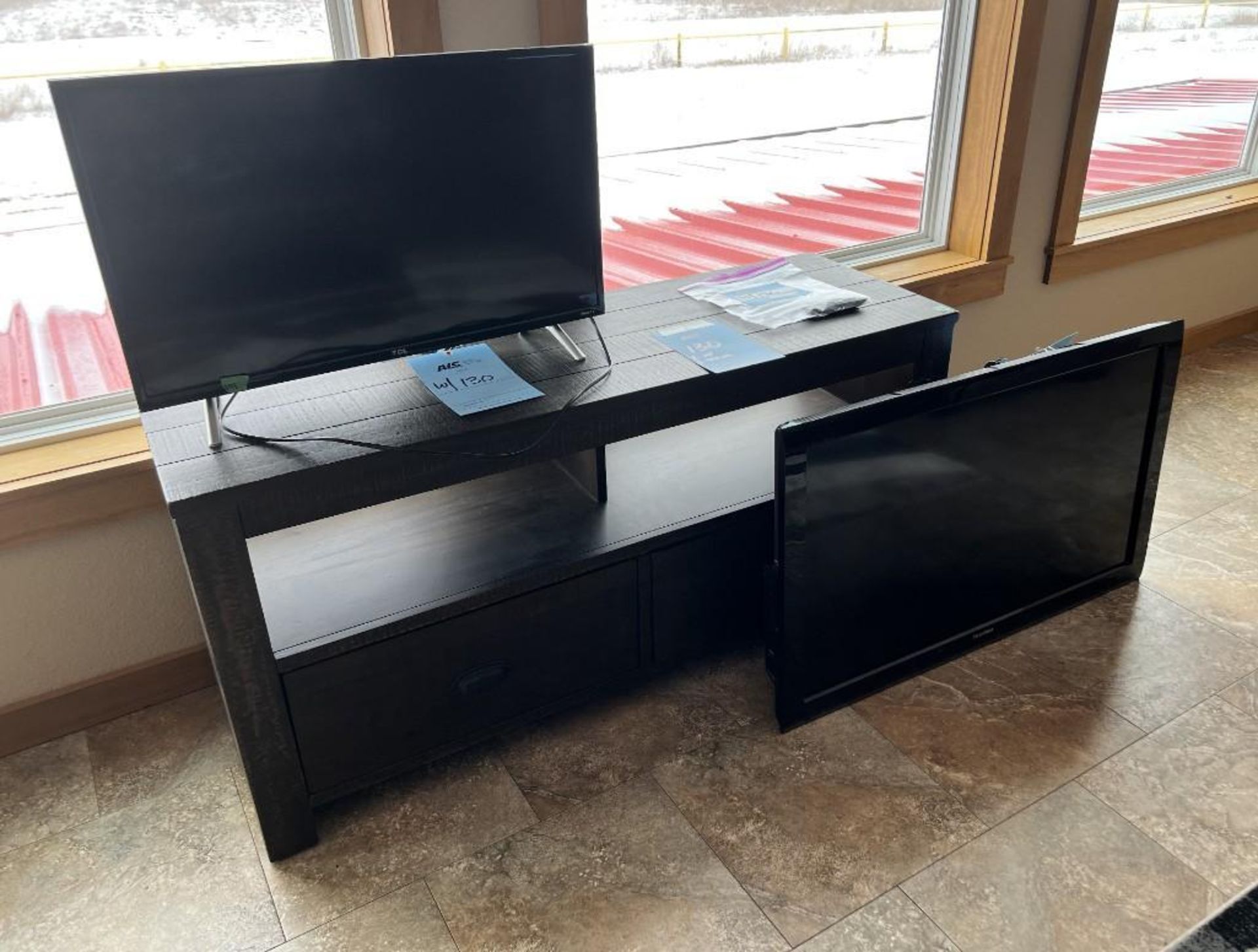 Lot Consisting Of: (1) TV Stand, (1) Toshiba model 40E220U TV, (1) TCL Roku model 32S305 TV.