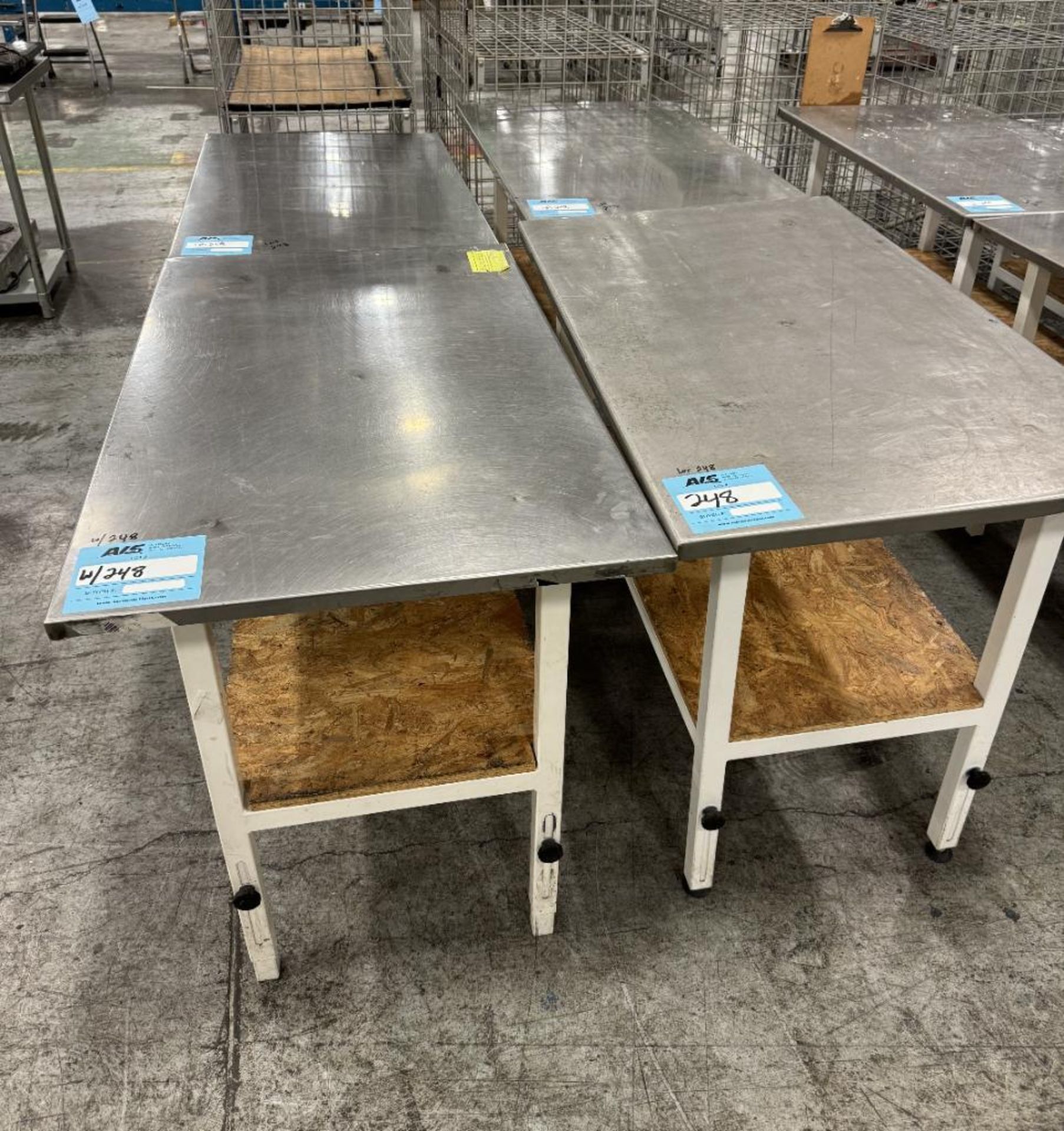 Lot Of (4) Stainless Steel Top Tables. With steel frame.