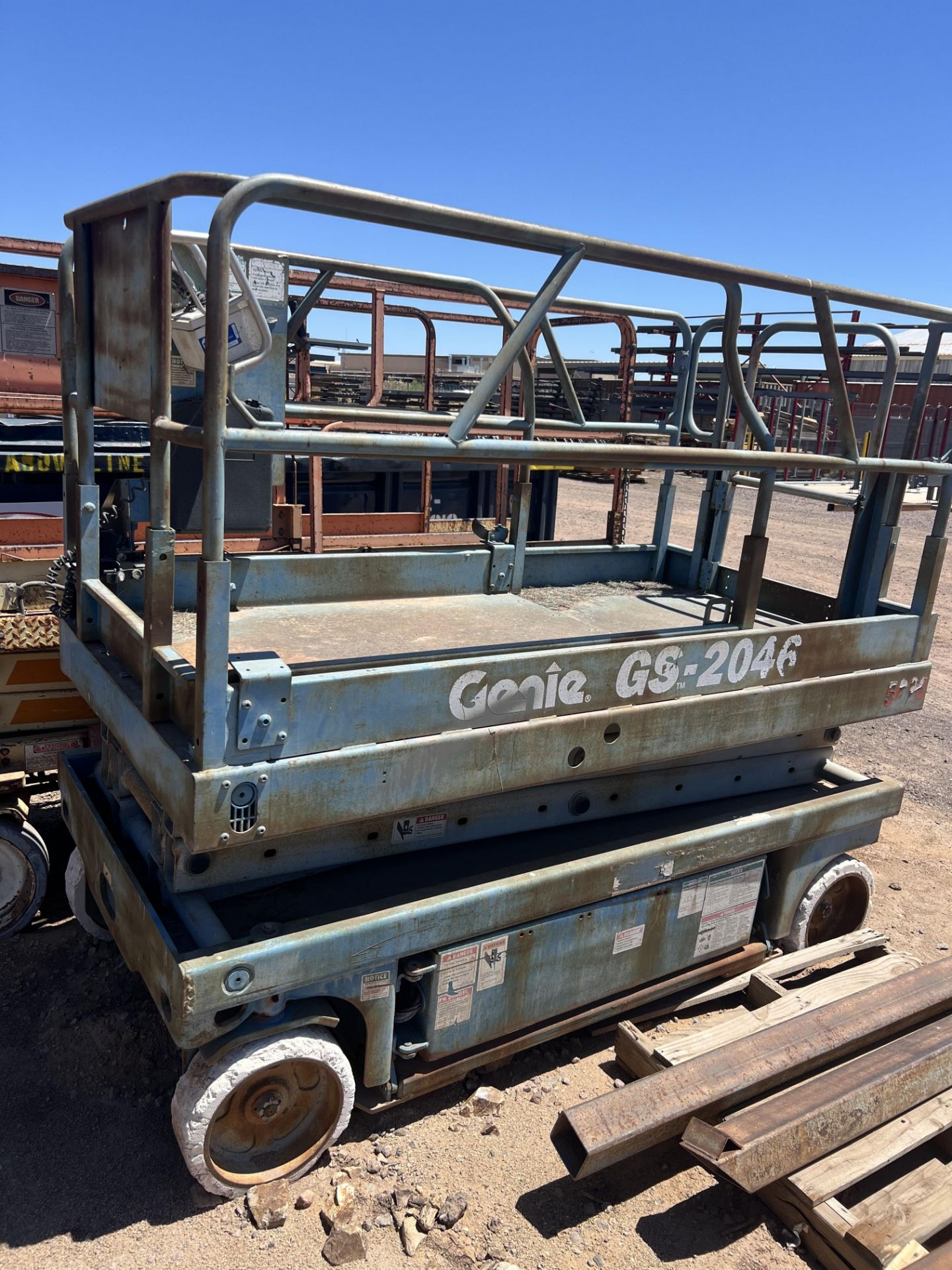 GENIE GS-2046 ELECTRIC SCISSOR LIFT, UNIT IS A WORKING UNIT, BUT WILL REQUIRE NEW BATTERIES.