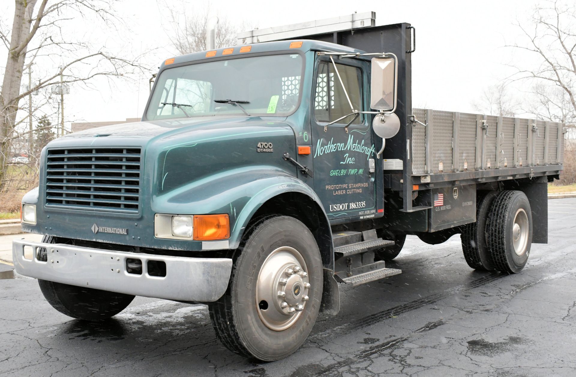 2000 Navistar International Model 4700, 4X2 188" Wheelbase Single Axle Dual Wheeled Flat Bed Stake