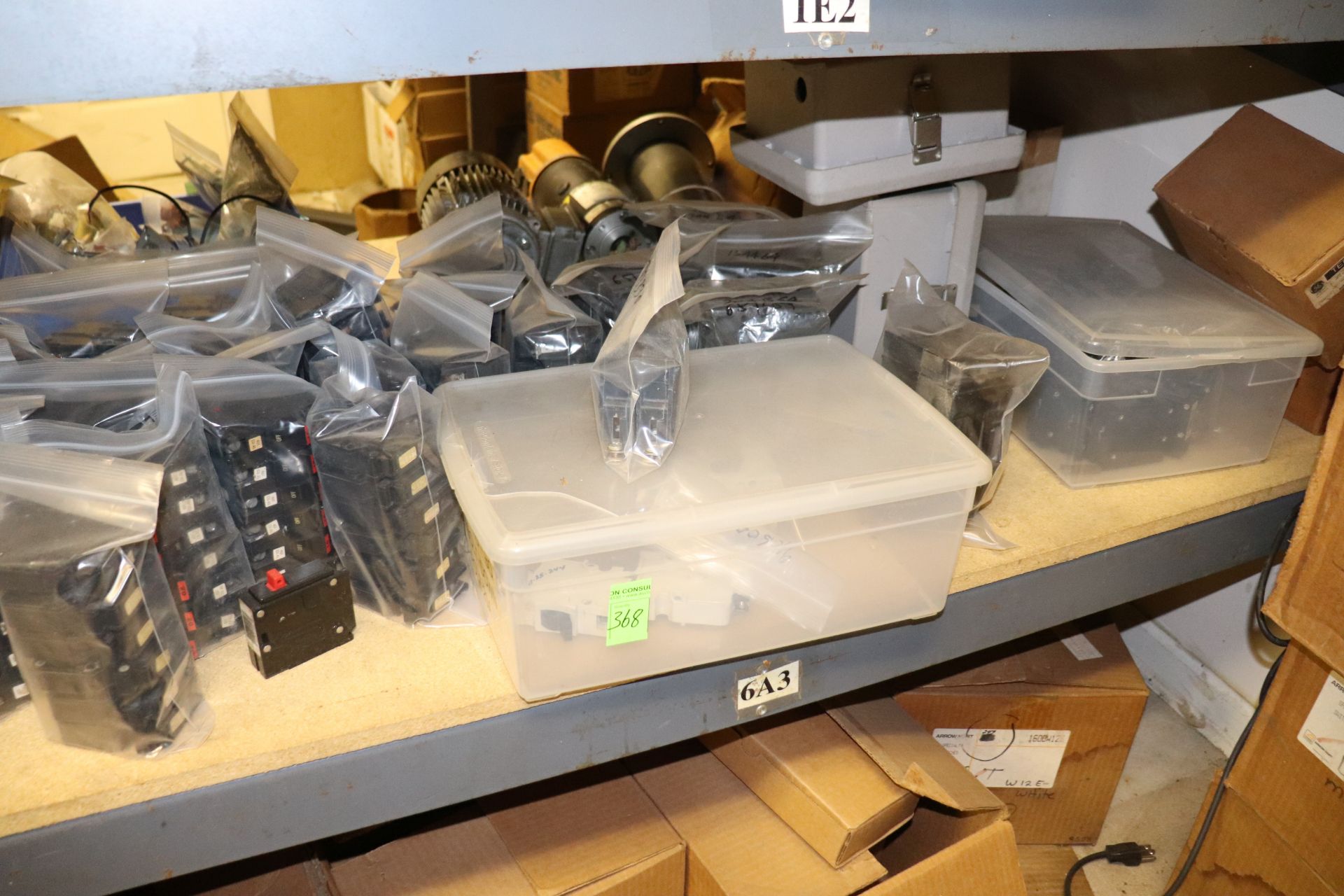 Shelf of miscellaneous circuit breakers, everything pictured