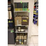 Four shelves of service manuals