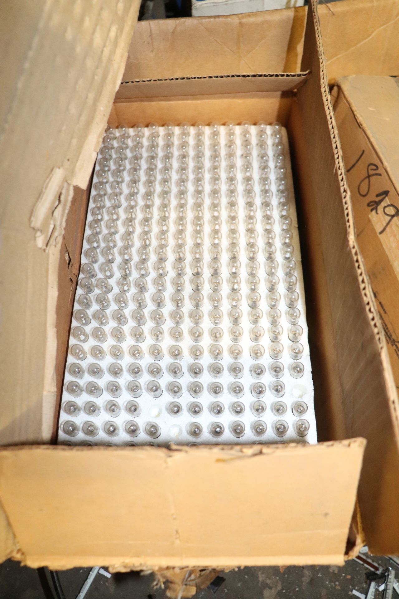 Pallet of small light bulbs, electrical components, circuit breakers, power bricks, and electric mot - Image 4 of 11