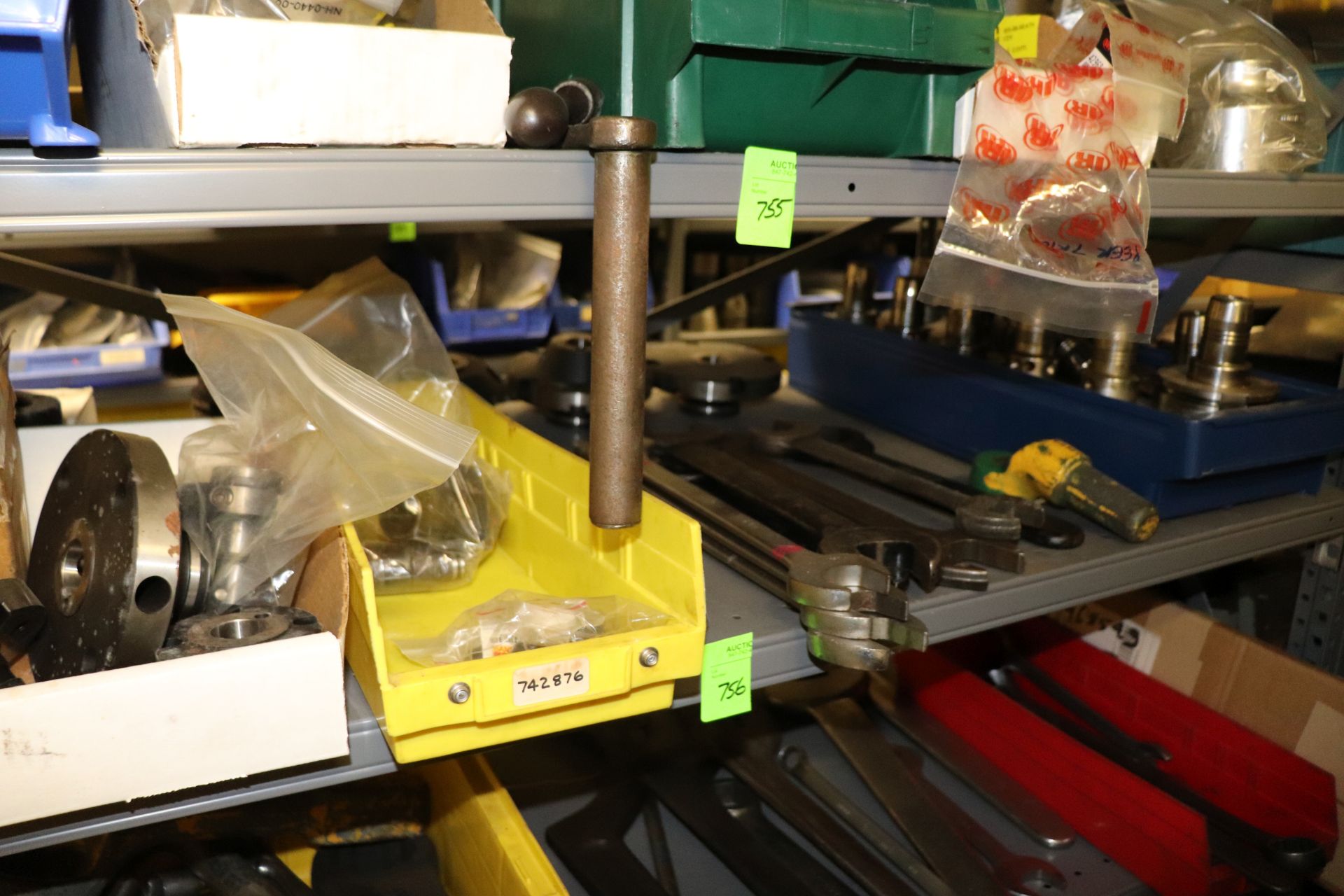 One shelf of tool holders and wrenches