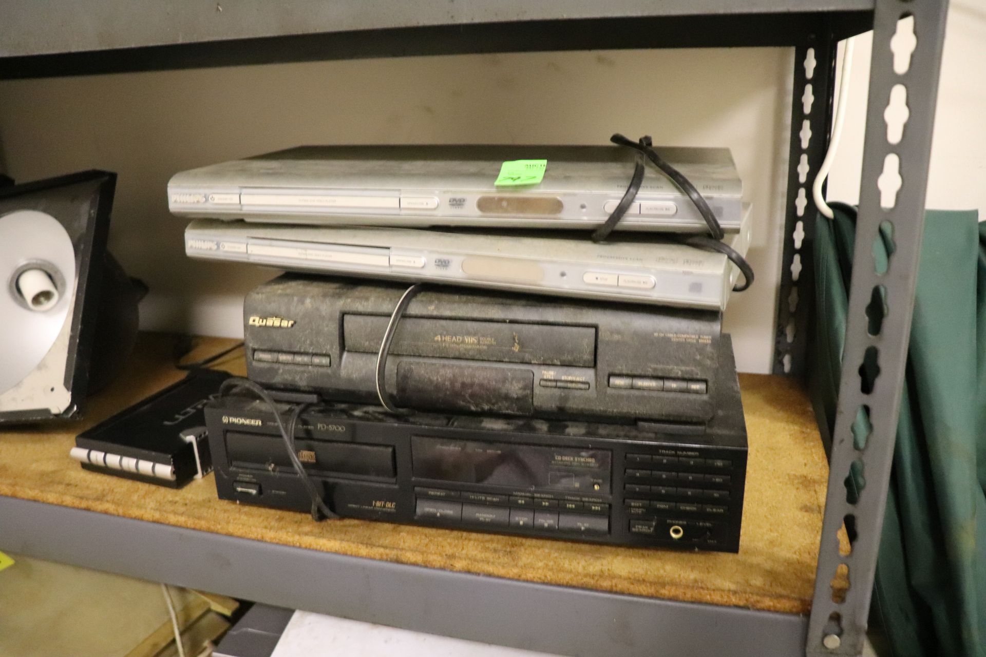 Two Philips DVD players, Questar VHS player, and a Pioneer PD-5700 CD changer