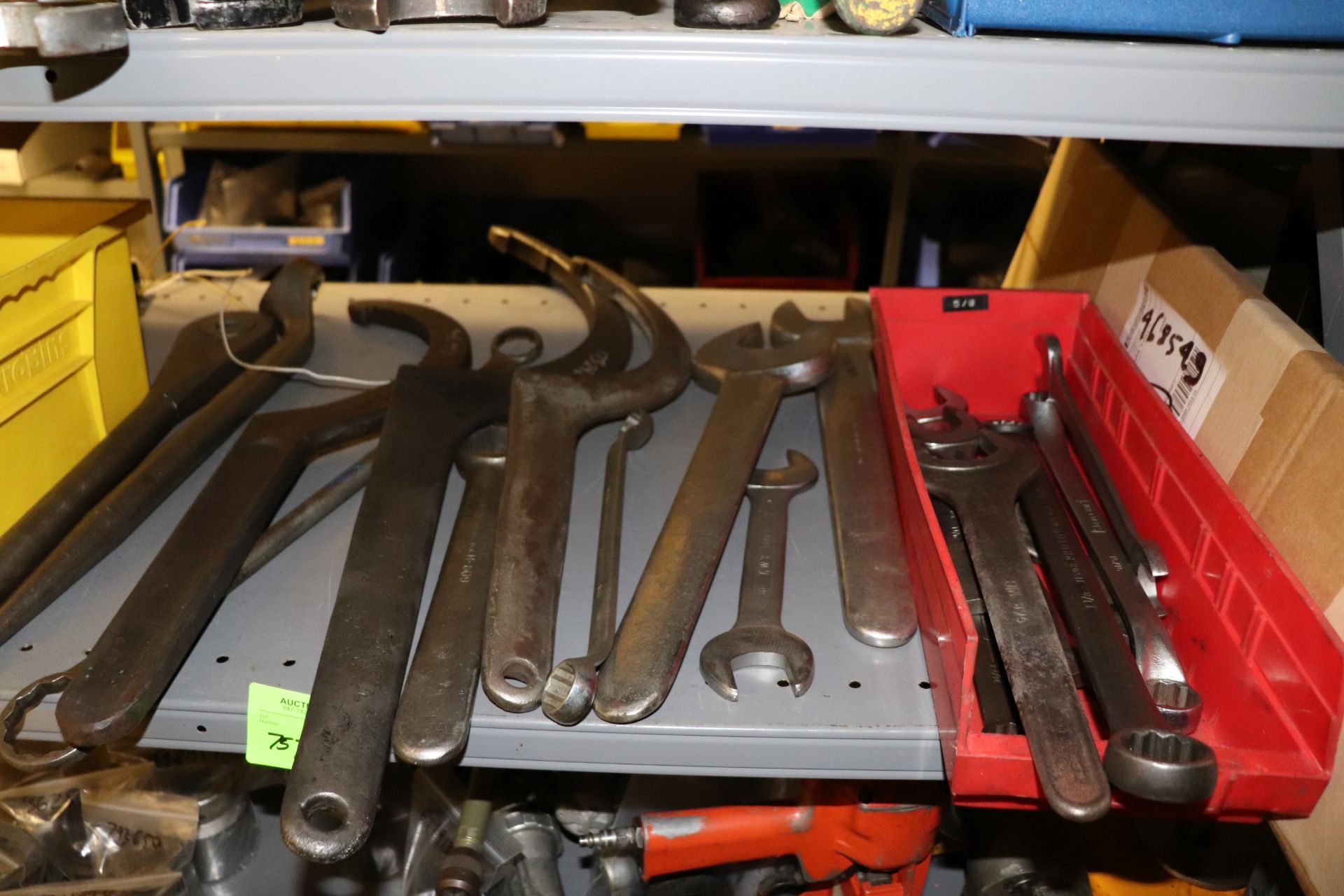 One shelf of wrenches