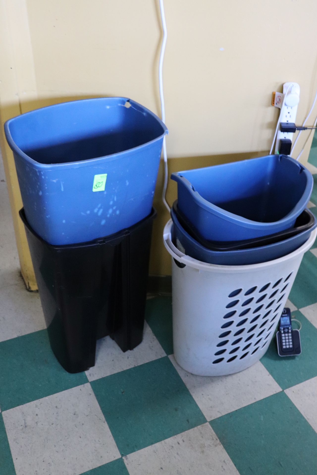 Five trash bins and one hamper