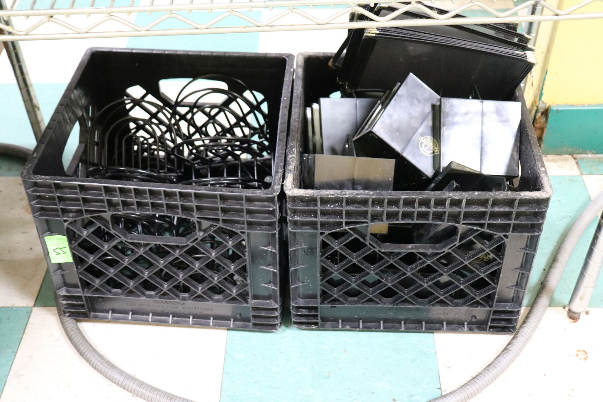 Two boxes Containing jelly packet dispensers menu and napkin holders