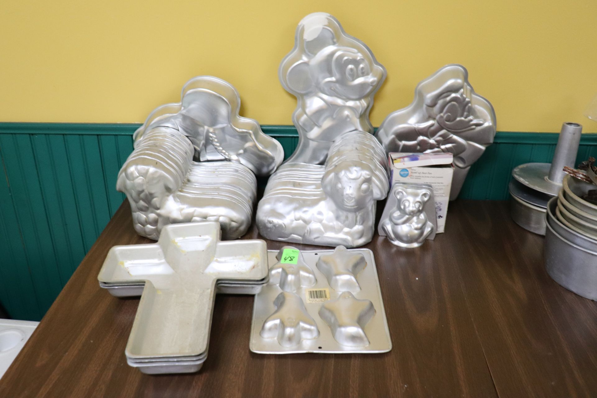 lot of holiday and religious themed cake pans