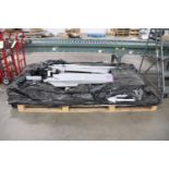Pallet of disassembled metal racking with casters