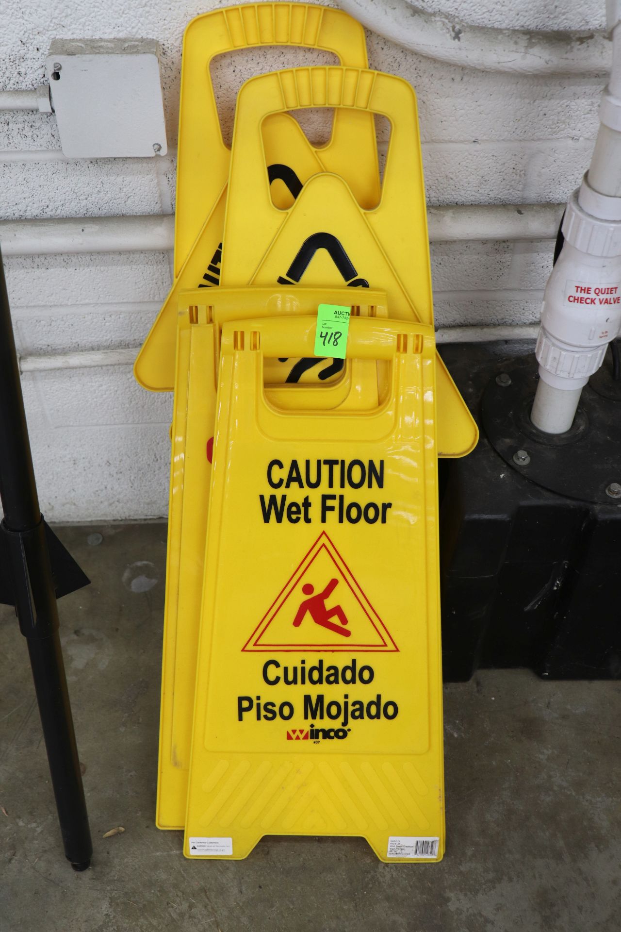 Four Caution Wet signs