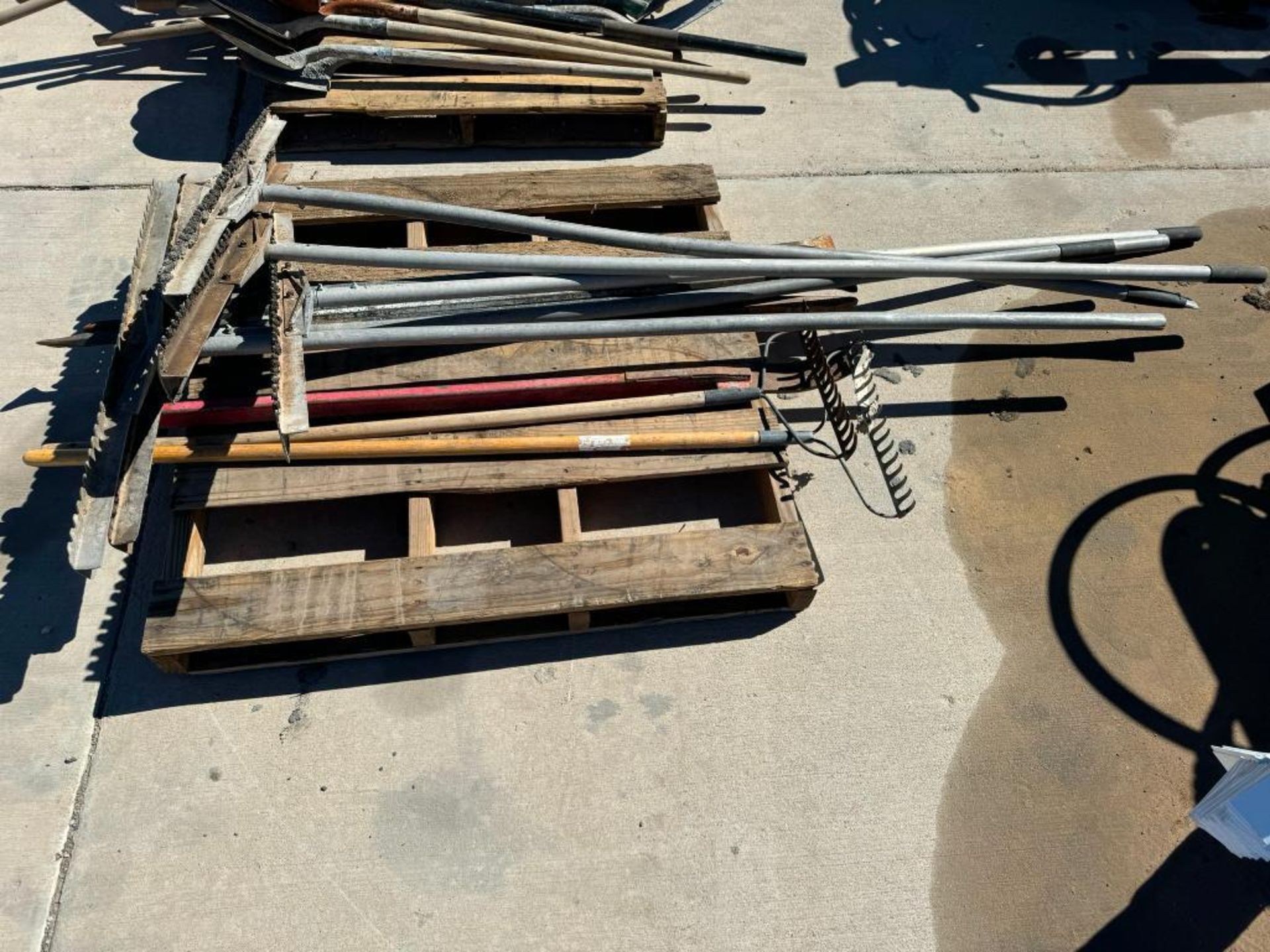 Pallet of Asphalt and Metal Yard Rakes