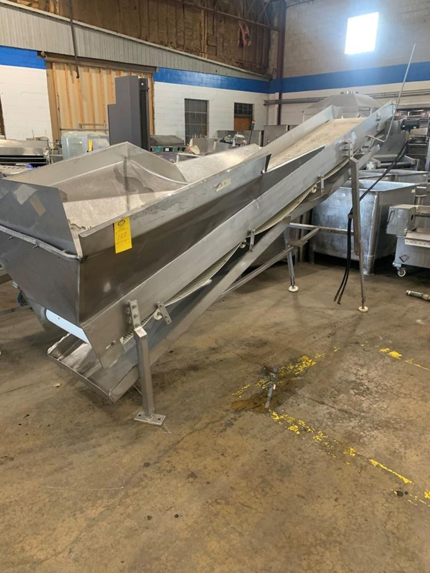 Incline Intralox Conveyor, 24" wide X 13' long belt with hopper, 70" discharge height (Located in