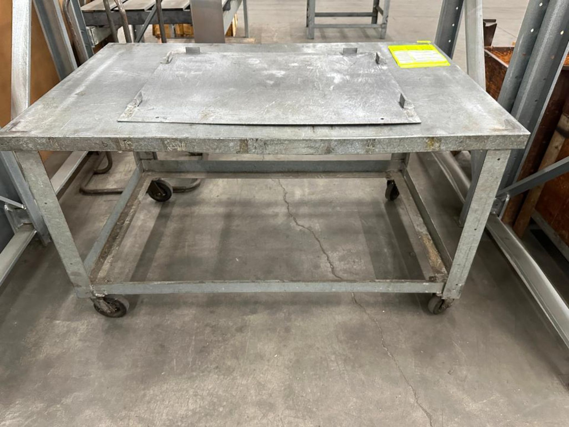 66" X 42" METAL FABRICATION TABLE ON CASTERS