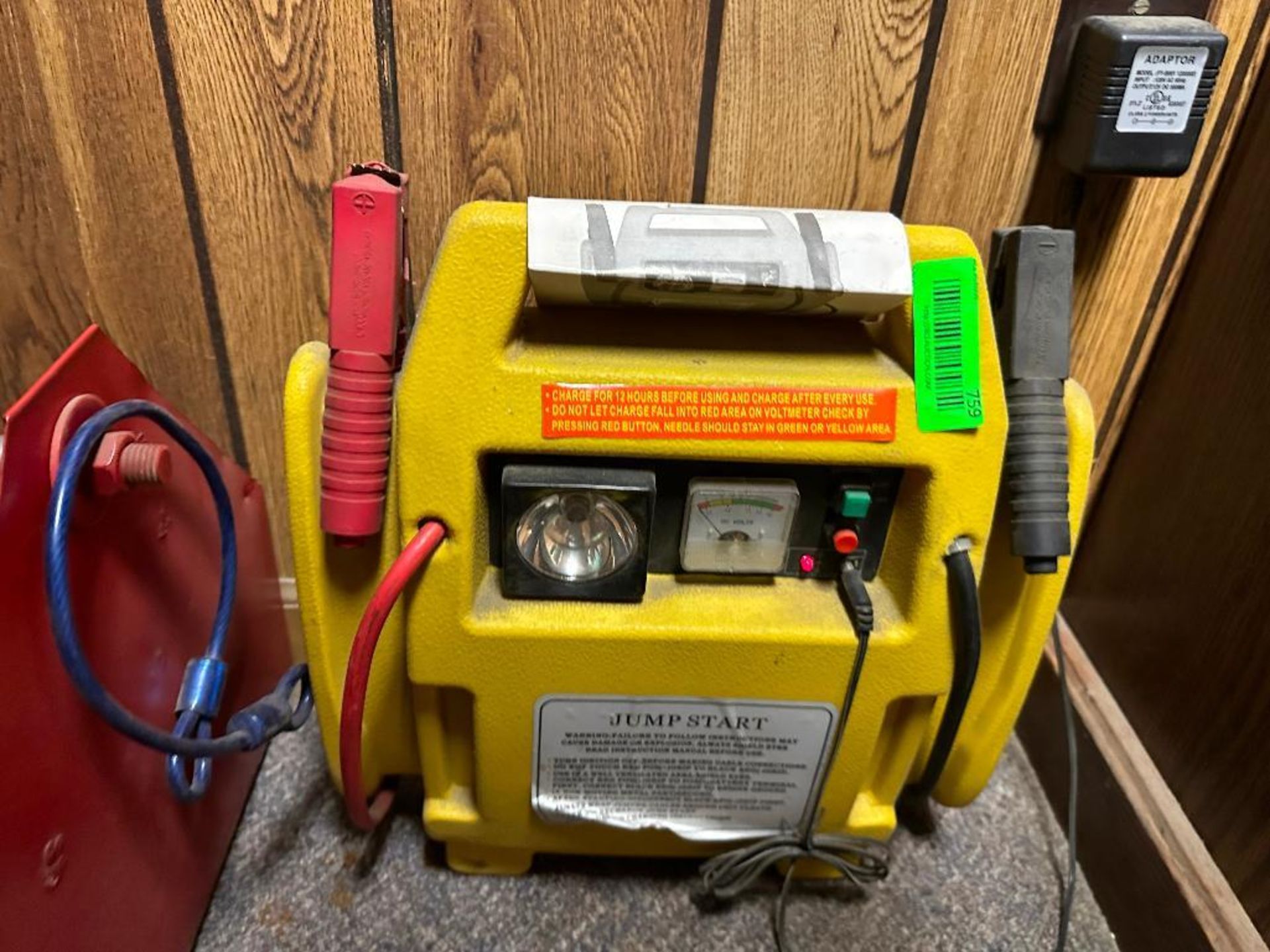 BATTERY CHARGER WITH ASSORTED CONTENTS OF BOOK SHELF AND OFFICE WALL