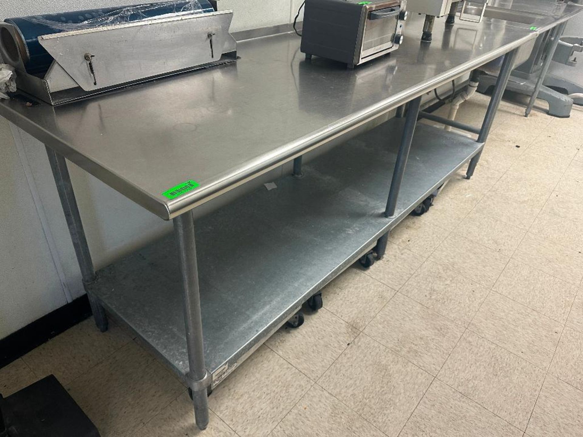 DESCRIPTION 8' X 30" STAINLESS TABLE W/ GALVIN ZED UNDER SHELF. ADDITIONAL INFORMATION CONTENTS ARE