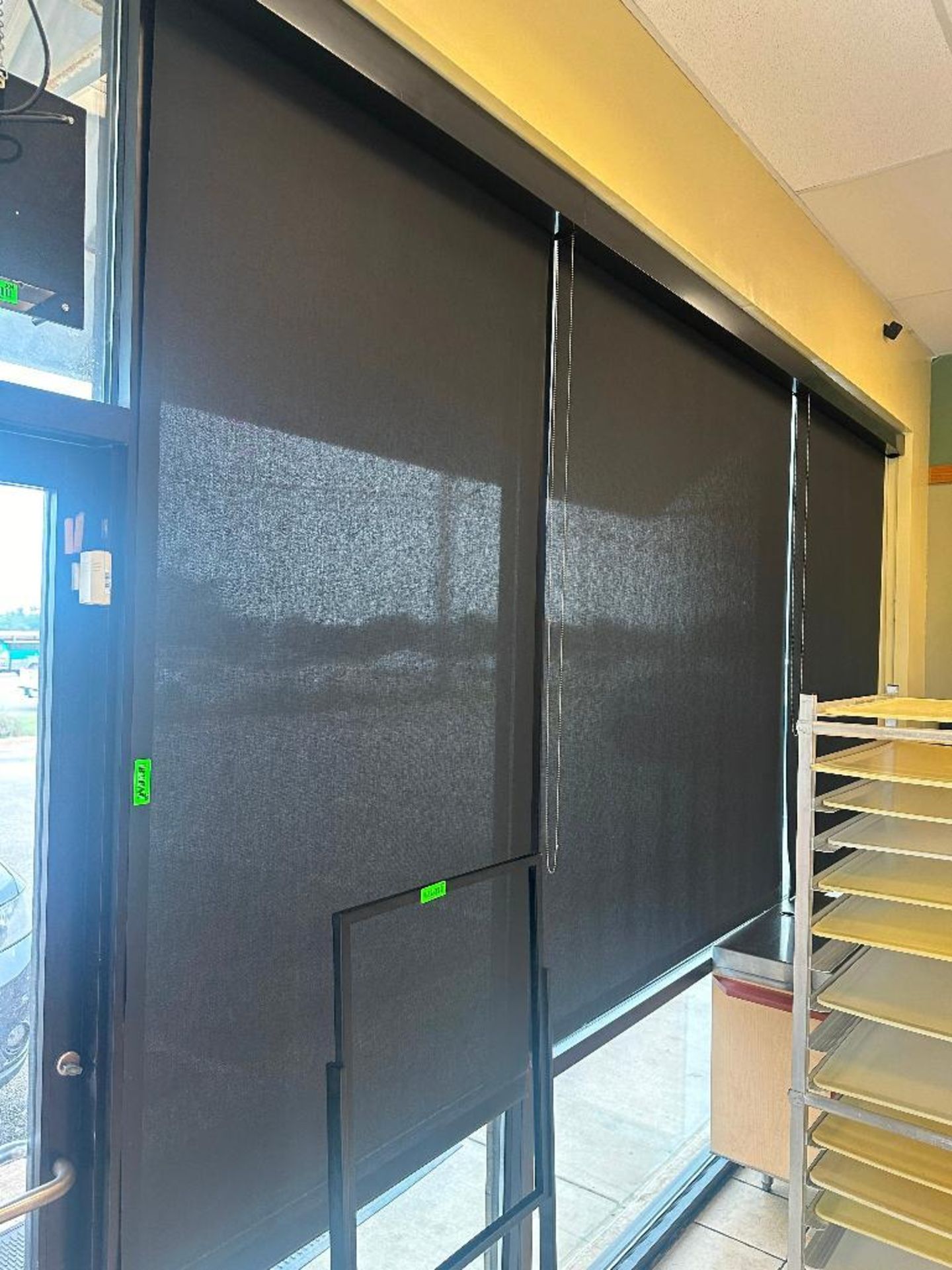 DESCRIPTION (3) 48" RETRACTABLE BLACK MESH SUN BLINDS. ADDITIONAL INFORMATION TOOLS REQUIRED FOR REM