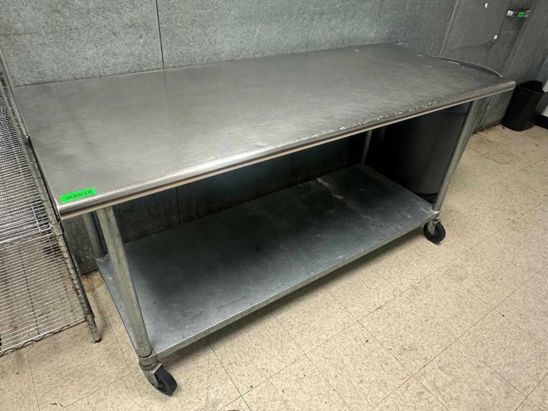 DESCRIPTION 72" X 30" STAINLESS TABLE W/ GALVANIZED UNDER SHELF. ADDITIONAL INFORMATION ON CASTERS S