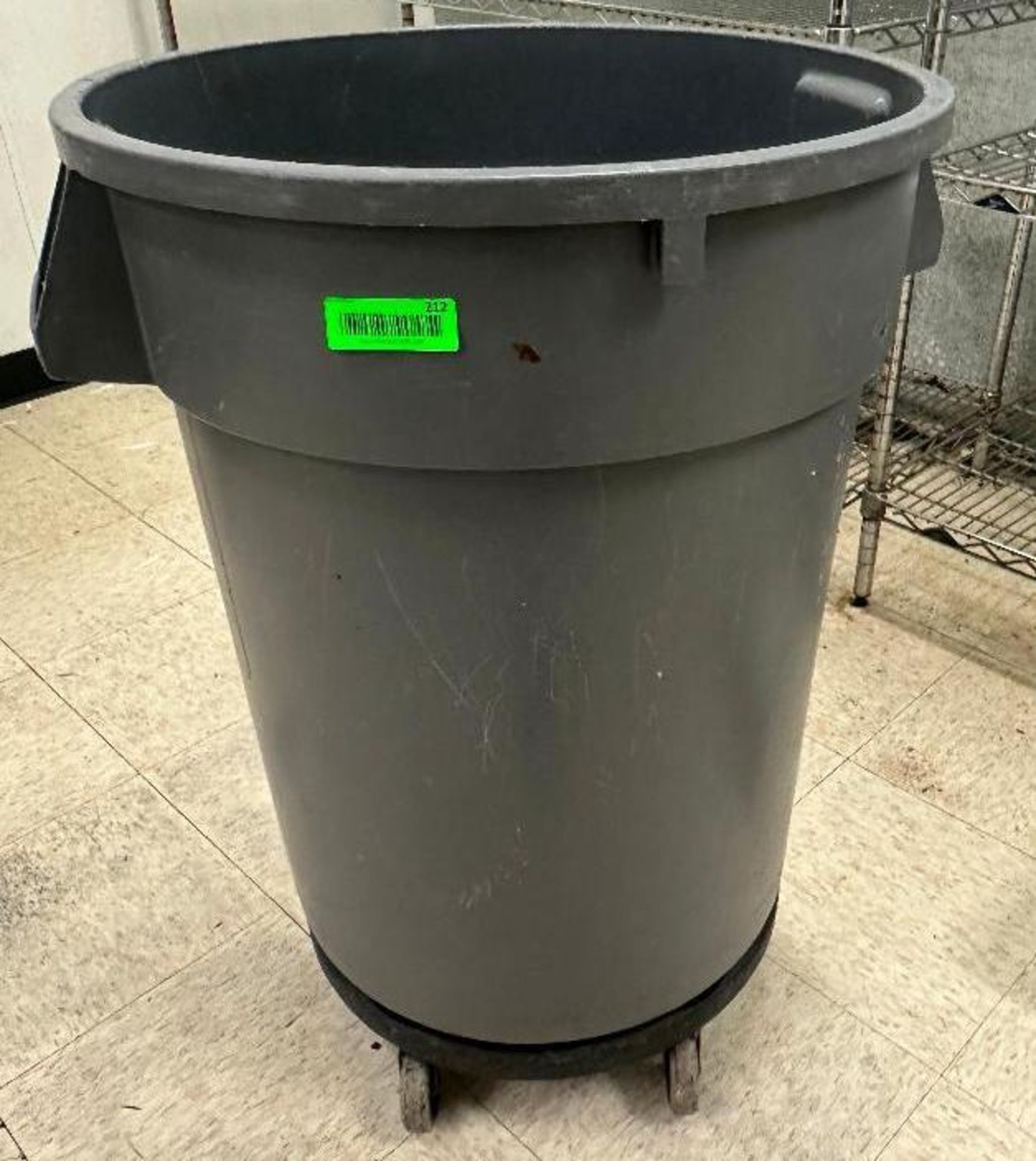 DESCRIPTION (2) BRUTE 44" GALLON TRASH CANS W/ DOLLYS BRAND / MODEL: RUBBERMAID THIS LOT IS: SOLD BY