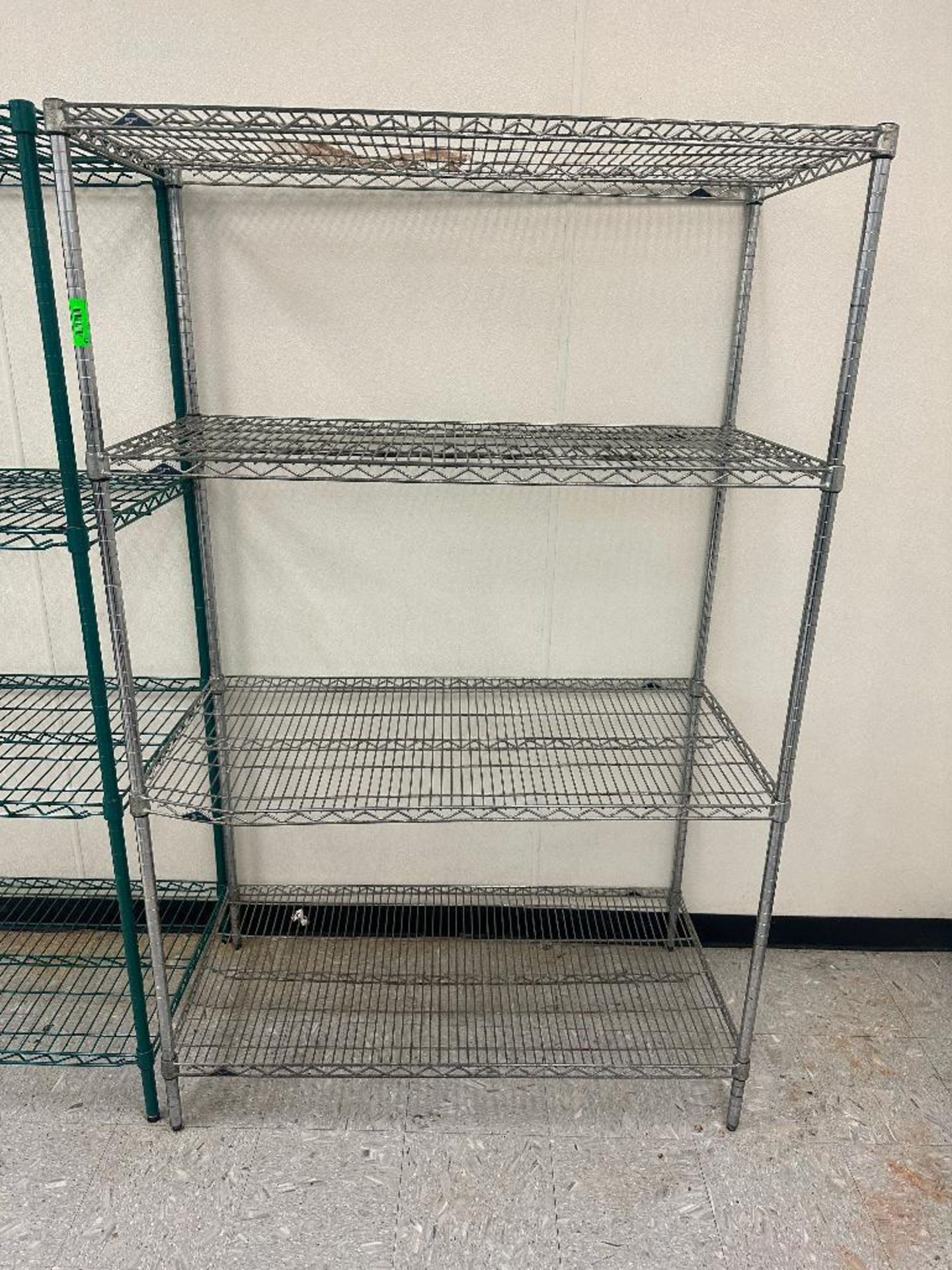 DESCRIPTION 48" X 24" FOUR TIER CHROME METRO SHELVING. SIZE 48" X 24" X 75" LOCATION 2110 W Slaughte