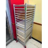 DESCRIPTION TWENTY PAN ROLL ABOUT TRAY RACK W/ CONTENTS - PLASTIC DOUGH BOARDS. BRAND / MODEL: WIN H