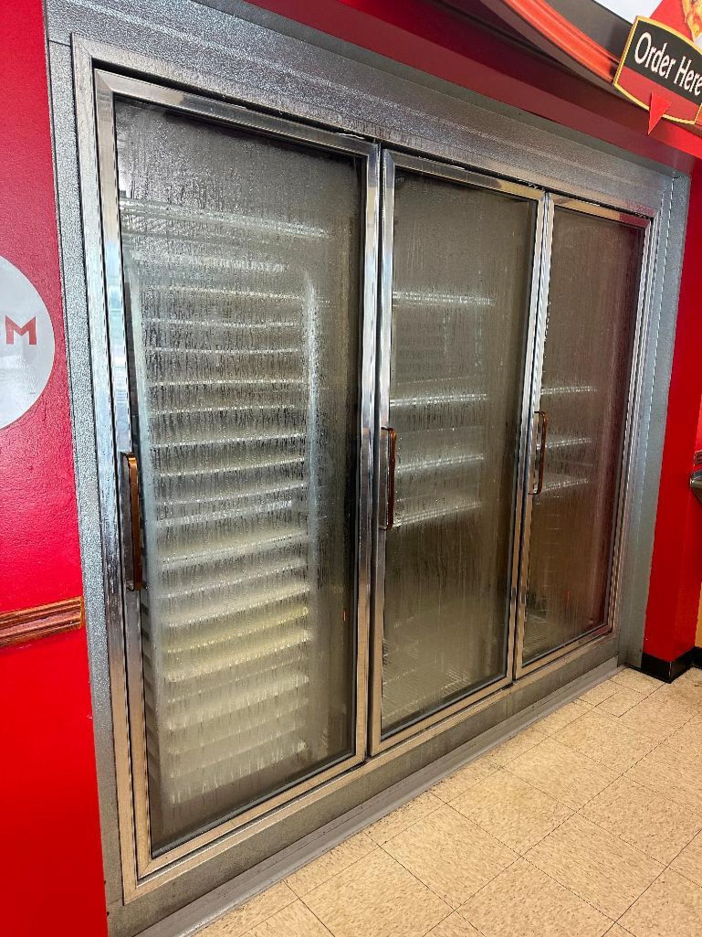 DESCRIPTION 14' X 10' WALK IN COOLER W/ THREE GLASS DOOR MERCHANDISER FRONT AND SIDE MAN DOOR. BRAND