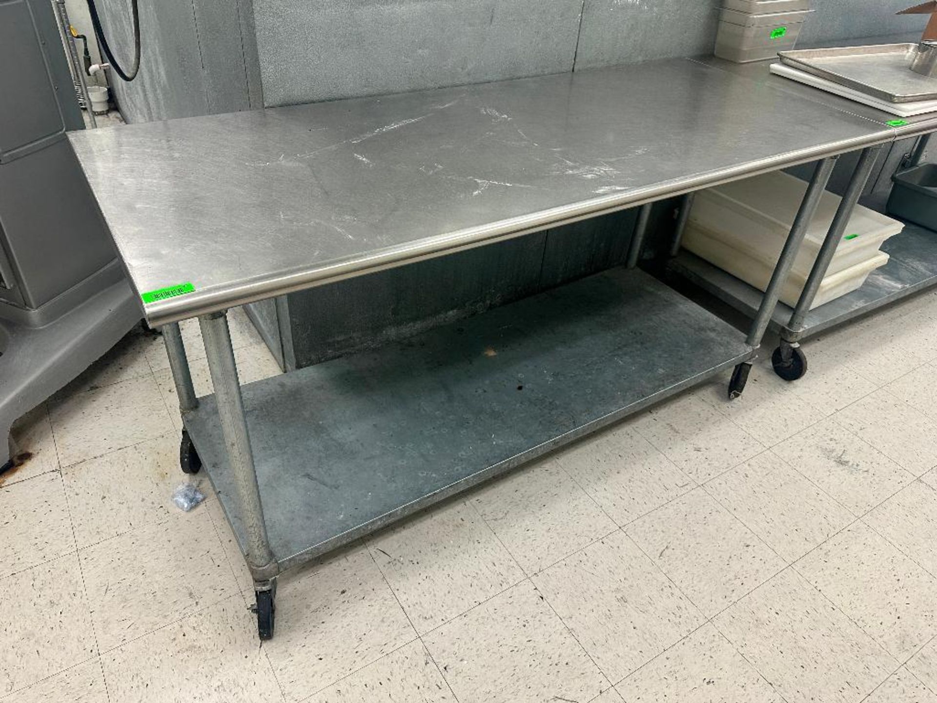 DESCRIPTION 72 "X 30" STAINLESS TABLE W/ GALVANIZED UNDER SHELF. ADDITIONAL INFORMATION ON CASTERS S