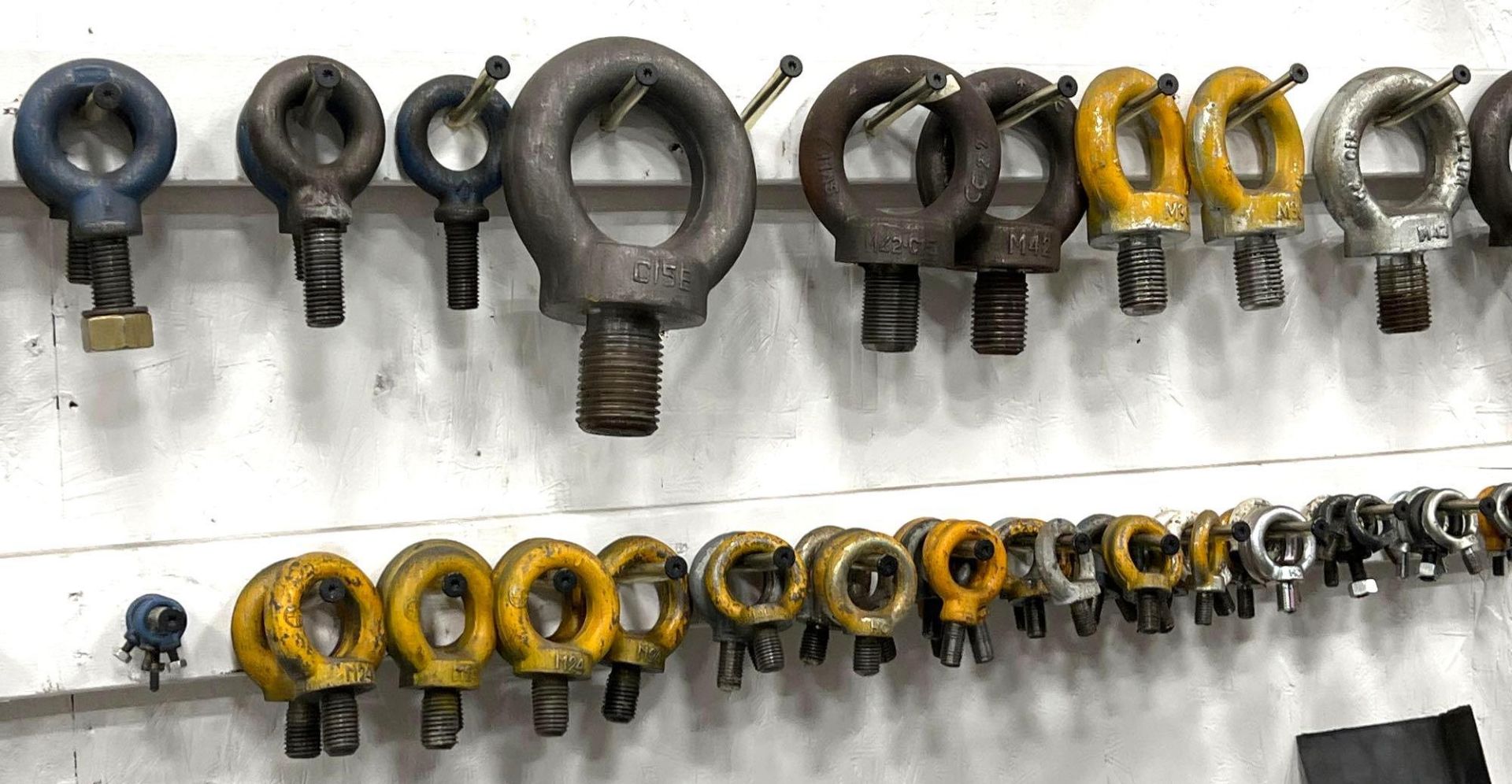 Lot of Assorted Eye Bolts, VariouSizes, Hanging on Wall - Image 4 of 5