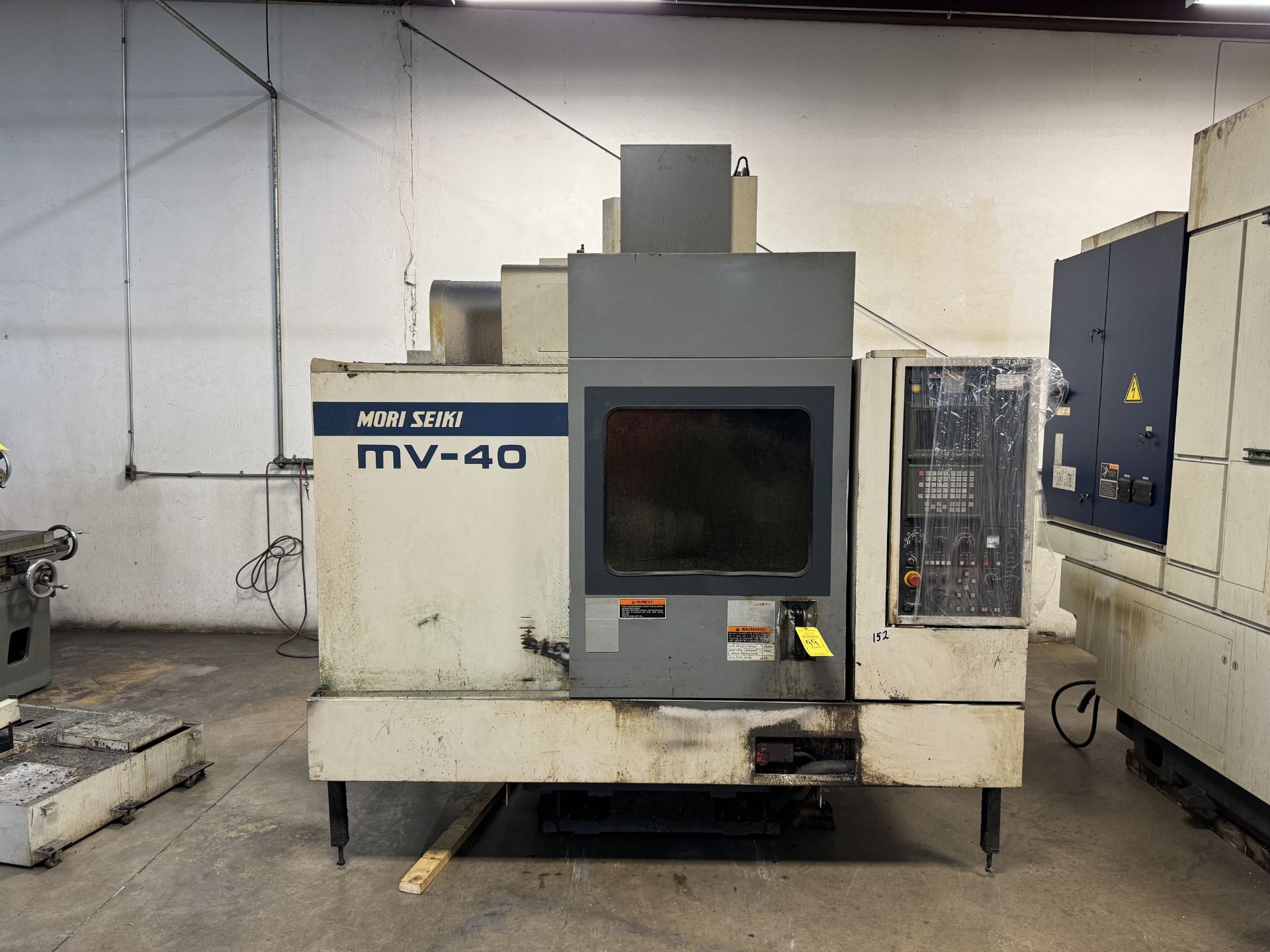 MORI SEIKI MV-40 VERTICAL MACHINING CENTER; 60 HZ/3/220V; (3) KURT VISES; 10 POSITION TOOL HOLDER;