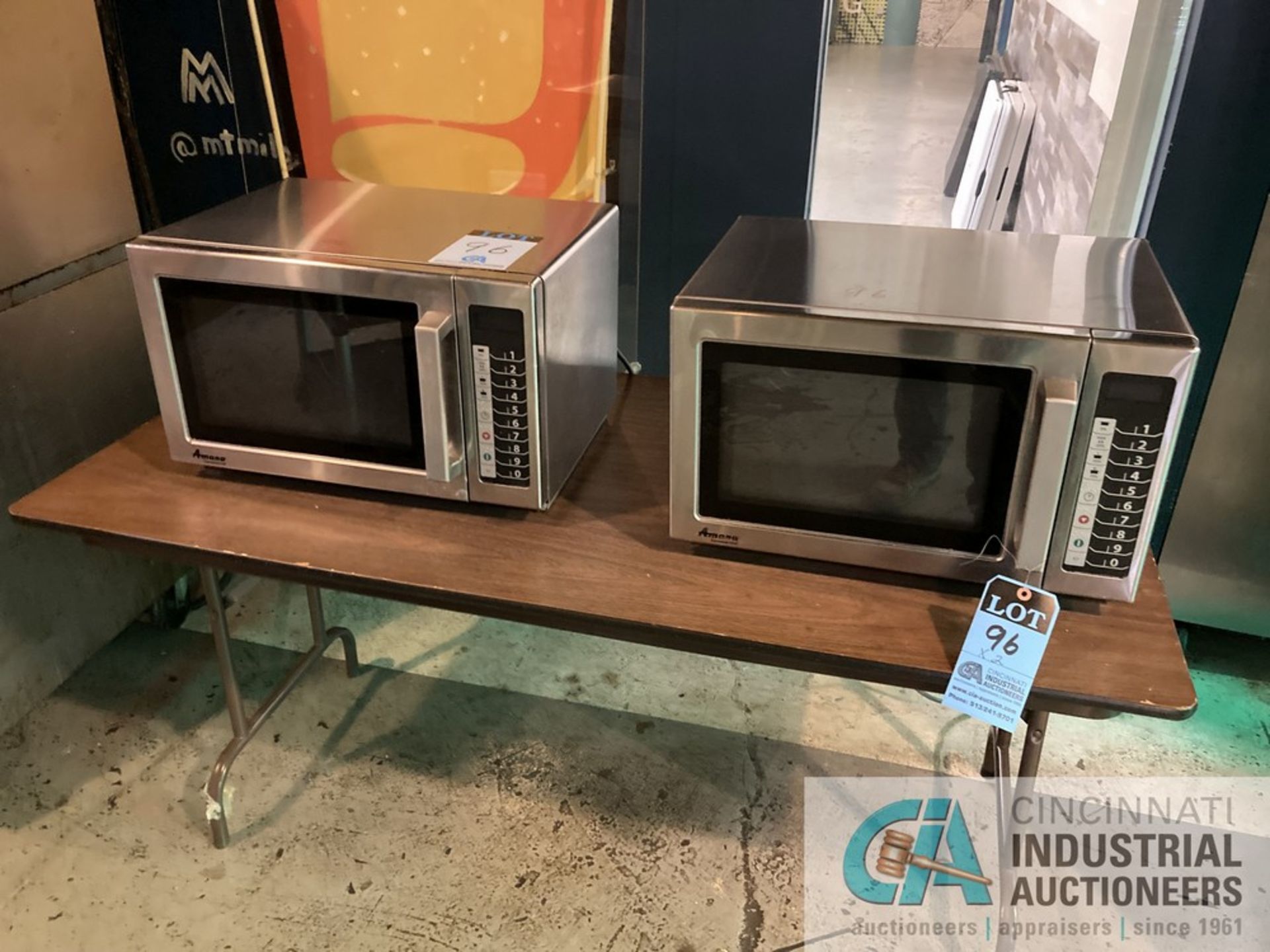 (LOT) (2) MICROWAVES AND TABLE **For convenience, the loading fee of $200.00 will be added to the