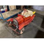 Antique gas-powered miniature parade truck with dump body