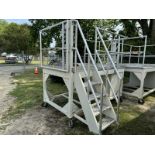 raised metal platform on wheels with guard rails