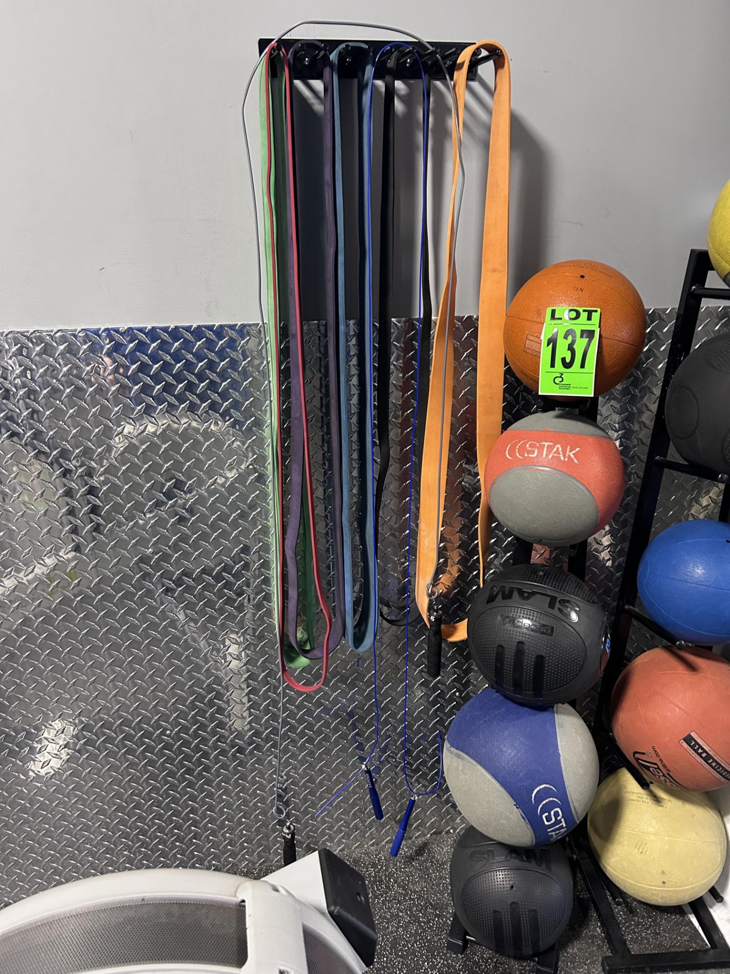 Lot of (5) Slam / Medicine Balls and Ball Rack with resistance bands