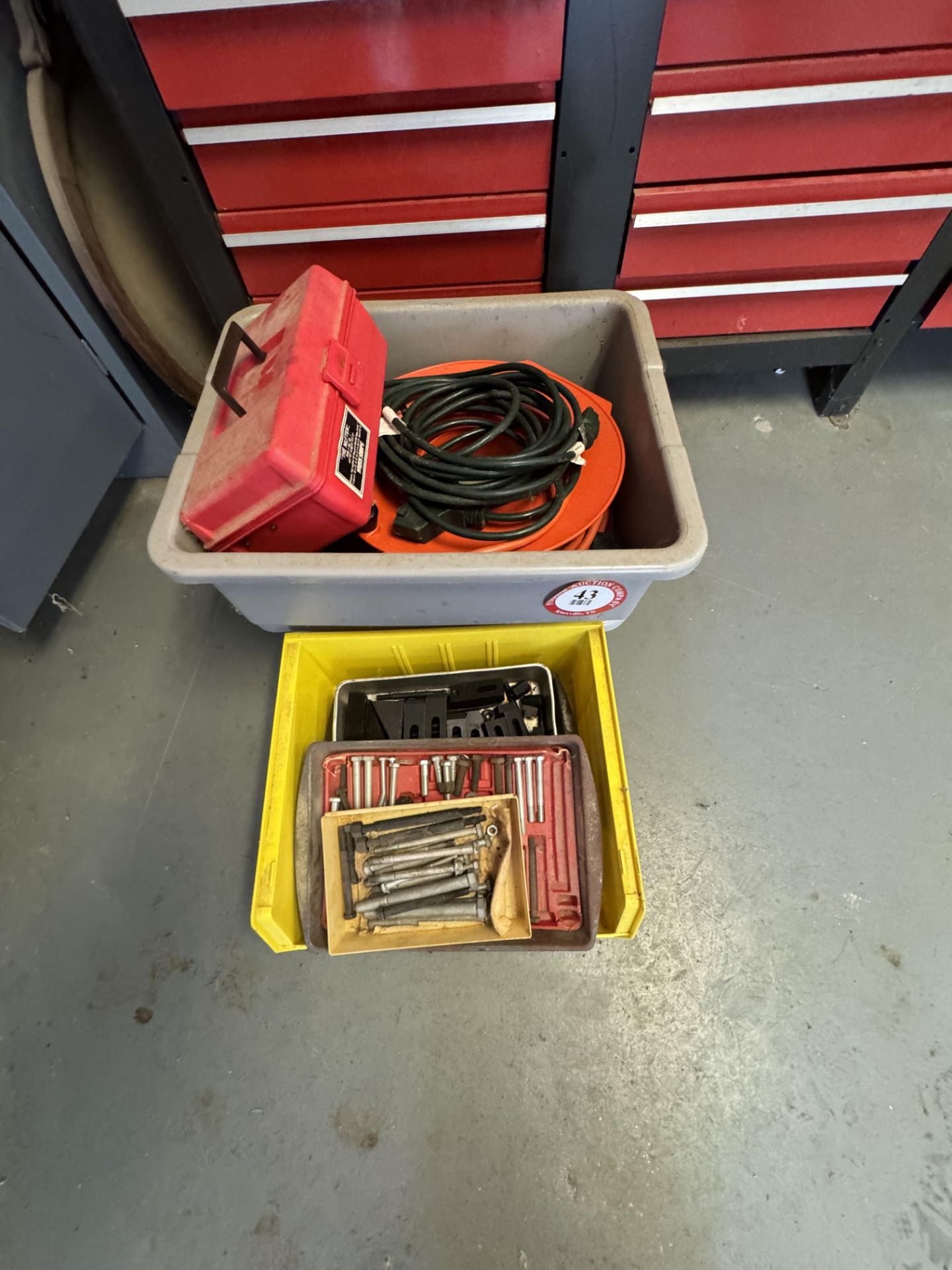 Contents of 4 Bins - Assorted Hold Downs, Extension Cords, Nuts, Bolts, Washers, etc.