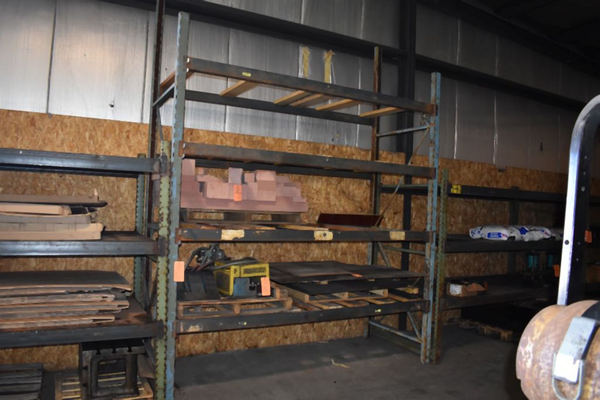 ONE SECTION OF BLUE PALLET RACKING WITH FOUR WOOD PLANK SHELVES, NO CONTENTS, 125"H x 112"W x 43"D