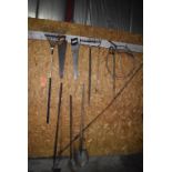 ASSORTED GARDEN TOOLS ON WALL