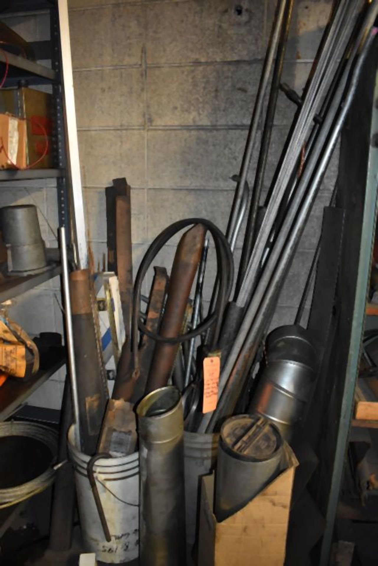 CONTENTS ON FLOOR INCLUDES GALVANIZED STOVE PIPE, STEEL ROD AND BUCKET WITH CONTENTS
