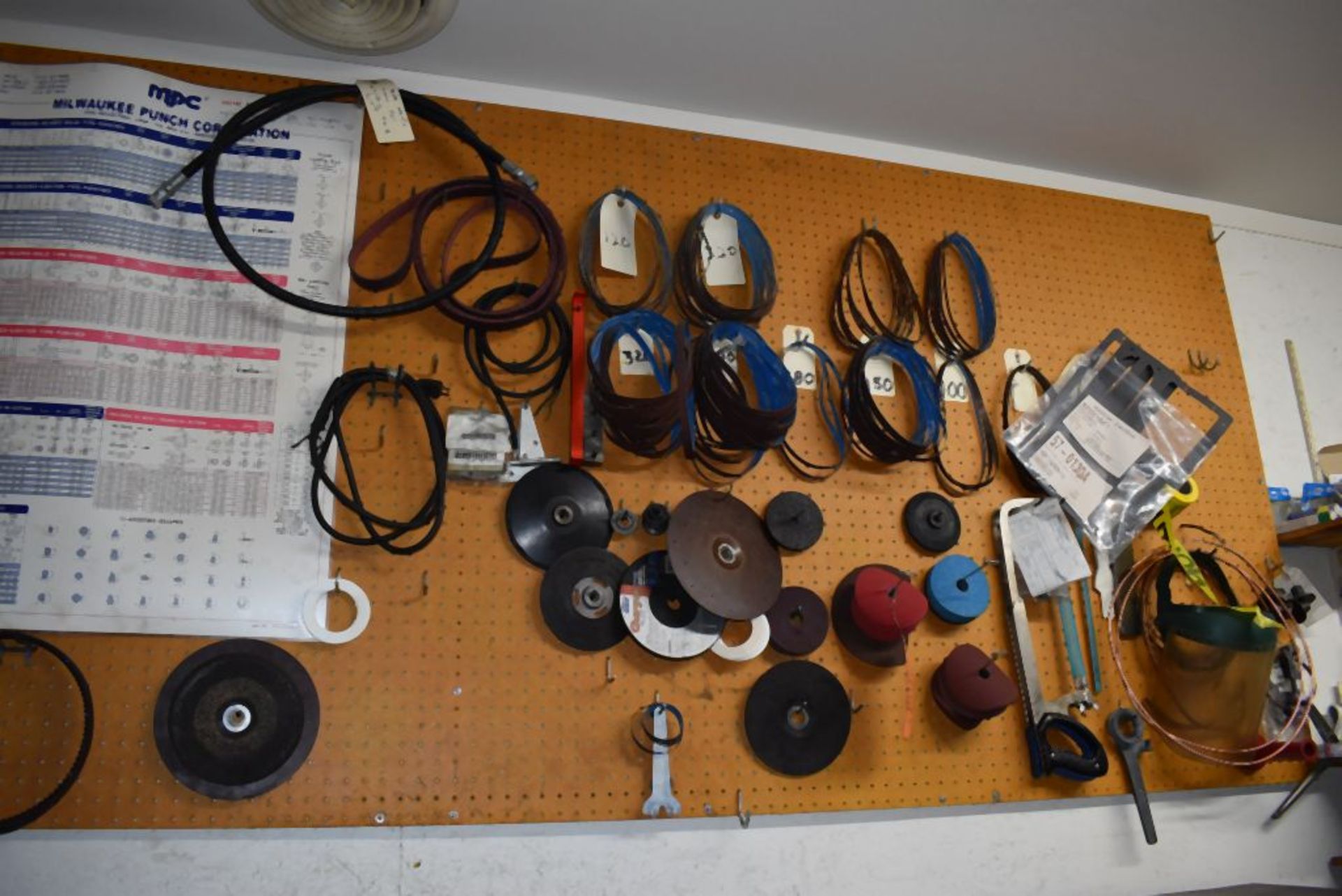 CONTENTS ON PEGBOARD; AIRFILE BELTS, SAWS, MISC. ABRASIVES, ETC.