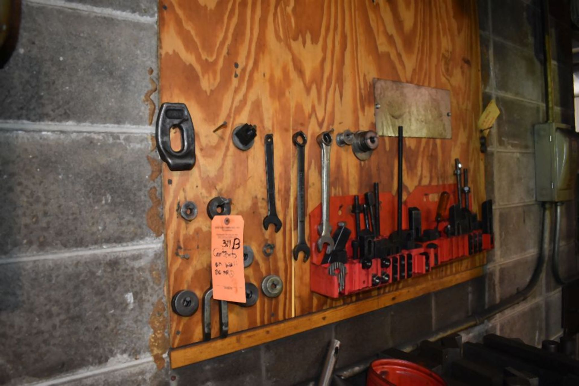 CONTENT ON THIS WALL - WRENCHES AND HOLD DOWN CLAMP DOWNS