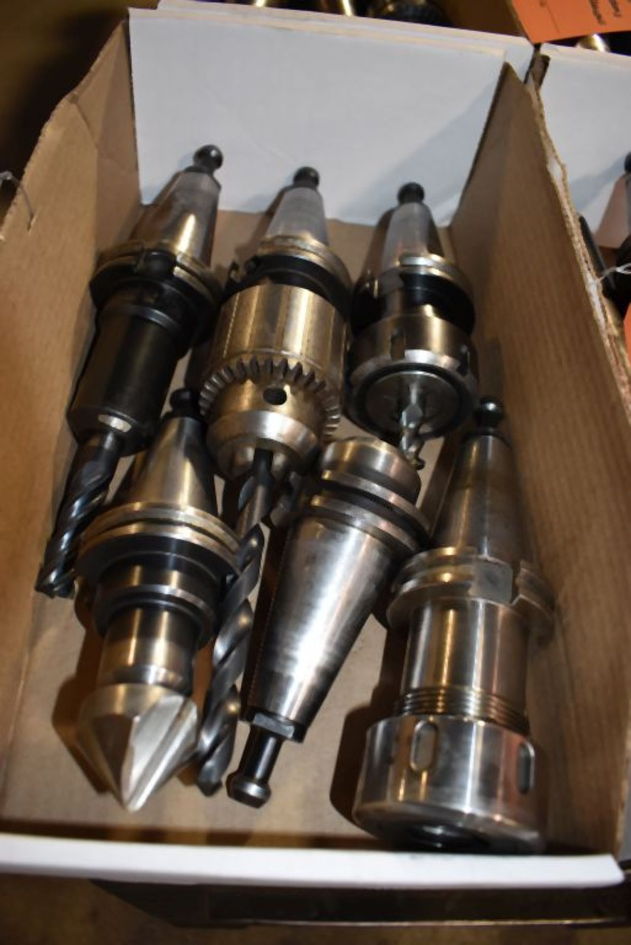 BIN WITH (6) CAT 40 TOOLING HOLDERS WITH CHUCK AND VARIOUS TOOLING