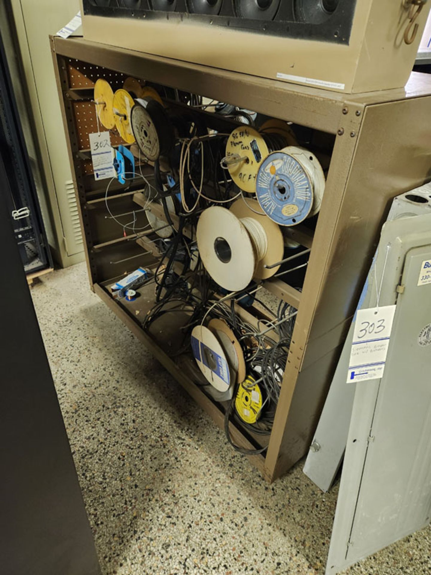 LOT OF ASSORTED WIRE ON PORTABLE STORAGE RACK