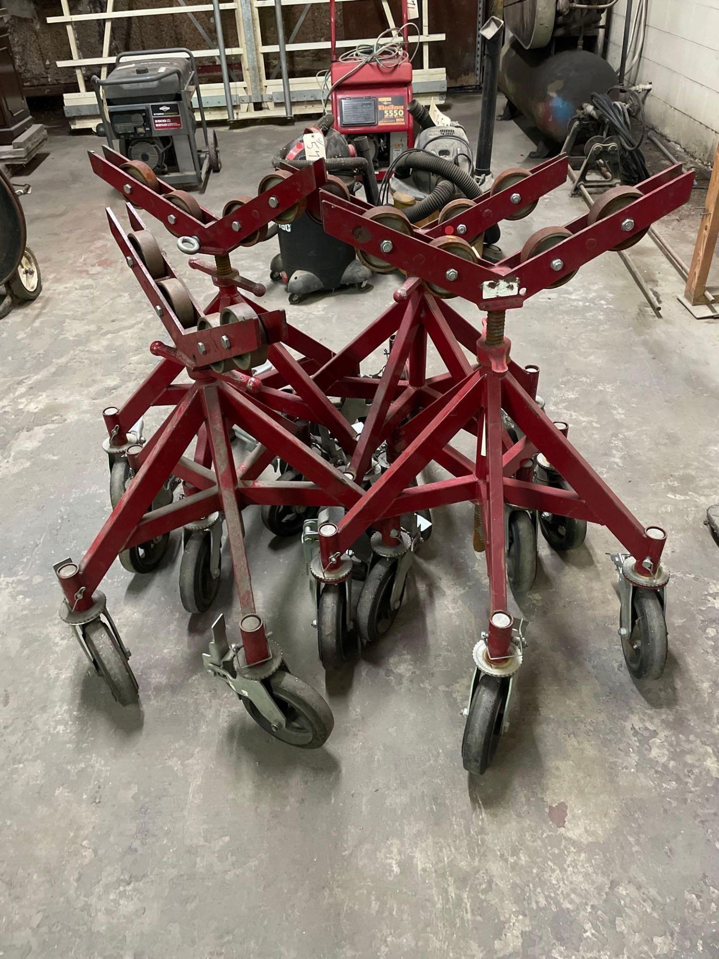 Lot of 4: Heavy Duty Roller Stands (Red). See Photo
