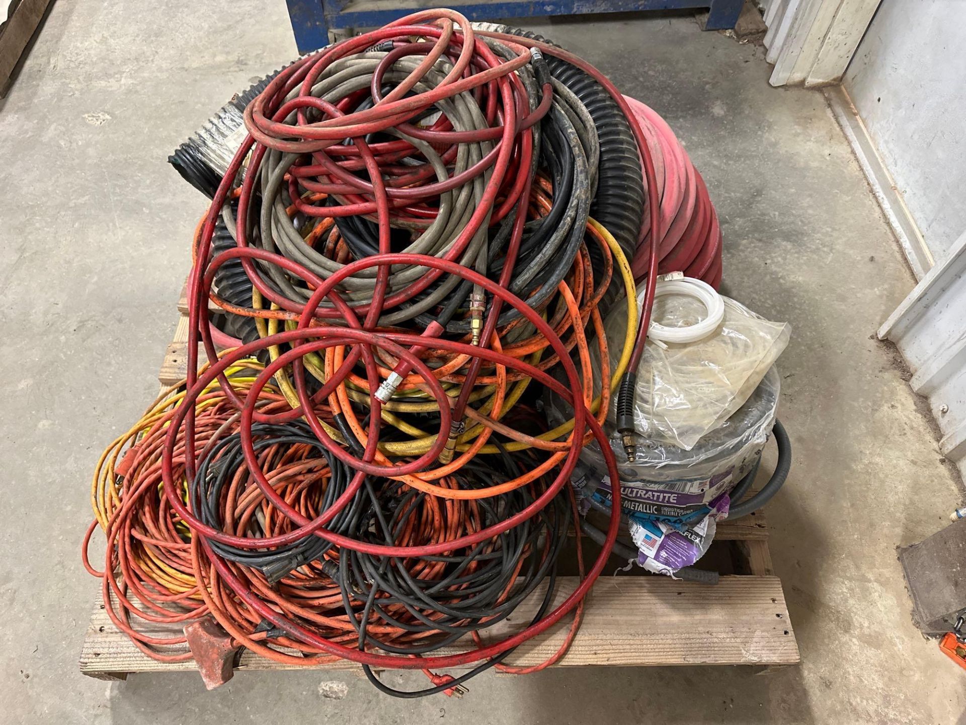 Pallet of Assorted Air Hoses and Extension Cords. See photo.