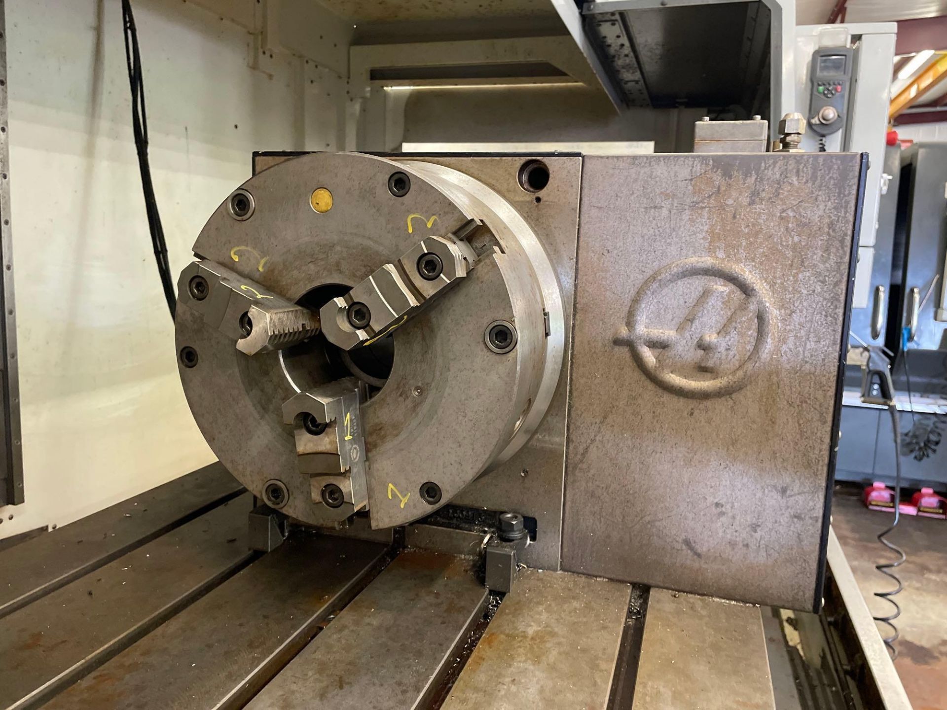 Haas 4th Axis Model HRT310 with 12” Bison 3 Jaw Chuck with 4” Thru Hole