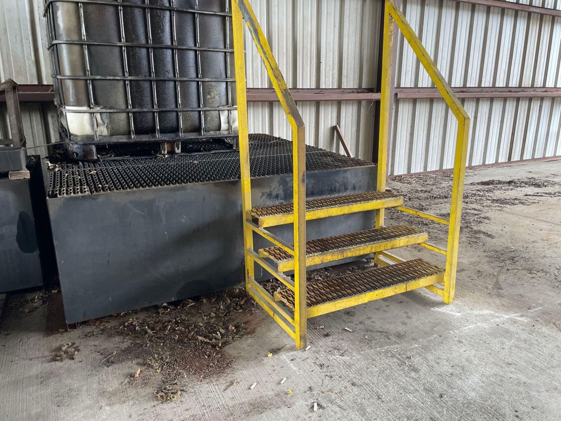 Oil Storage container with yellow rails and stairs 72” X 72” X 26”