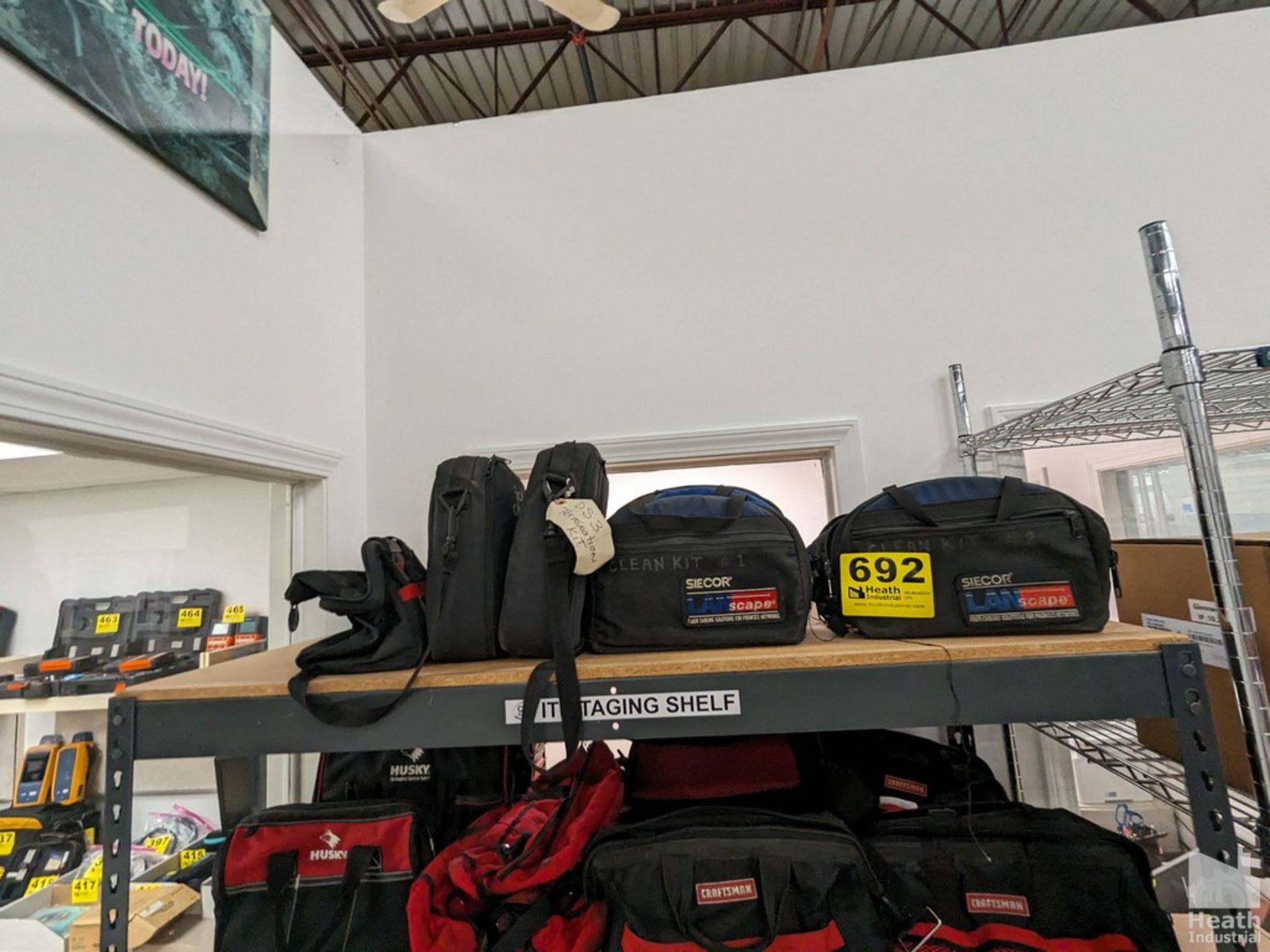 ASSORTED TOOL BAGS ON TOP SHELF