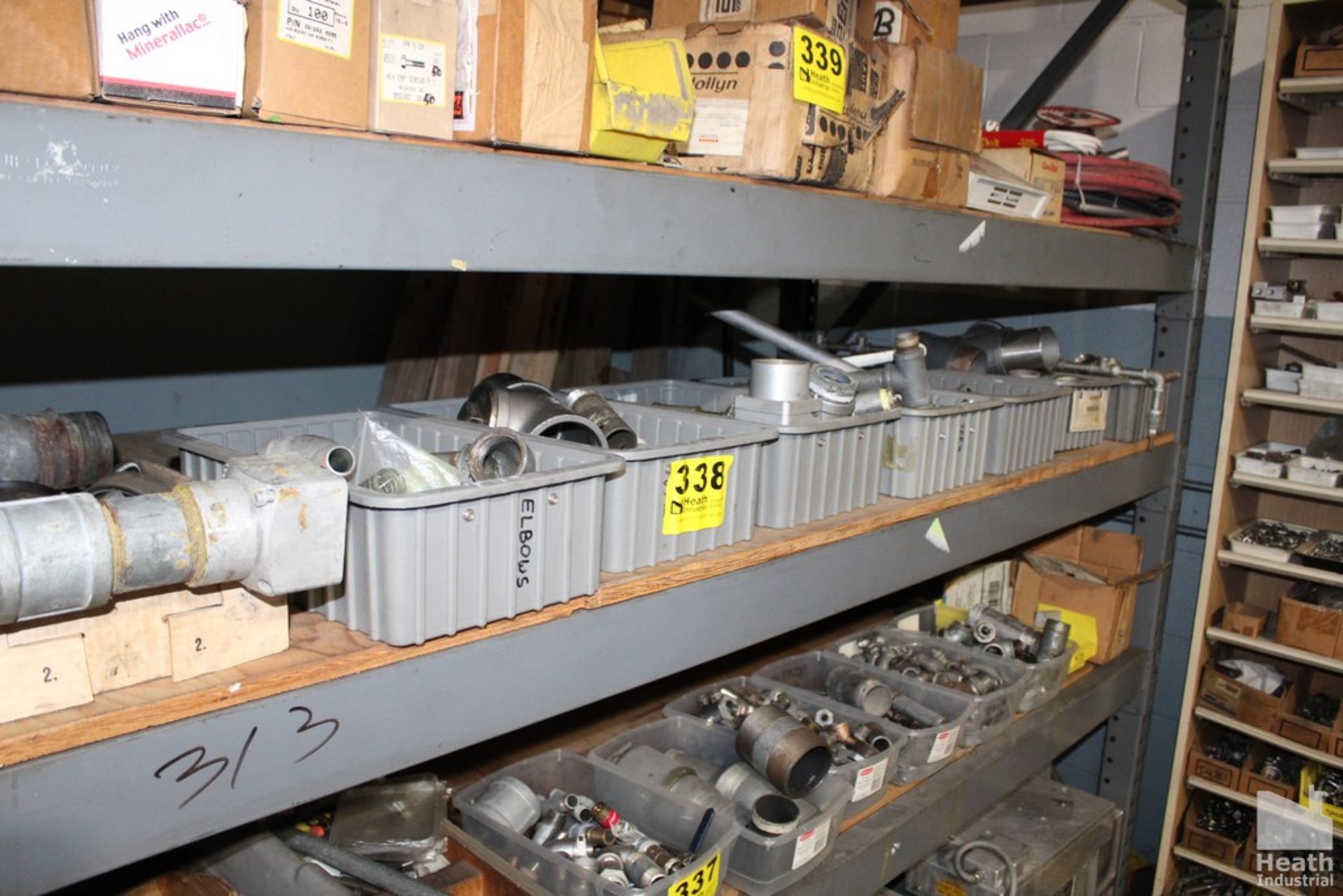 ASSORTED PIPE FITTINGS ON SHELF