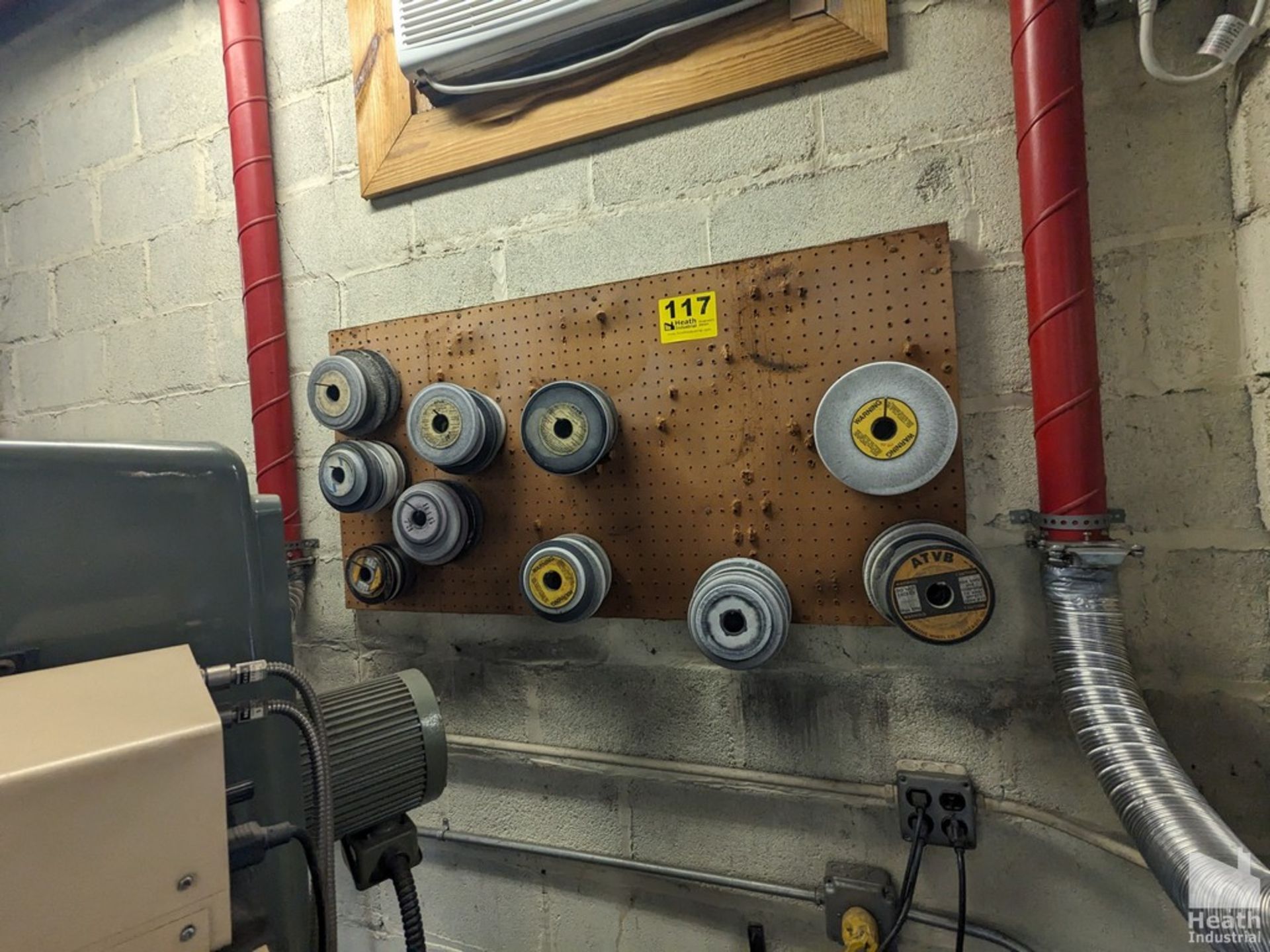 ASSORTED GRINDING WHEELS ON PEG BOARD (WALL MOUNTED)