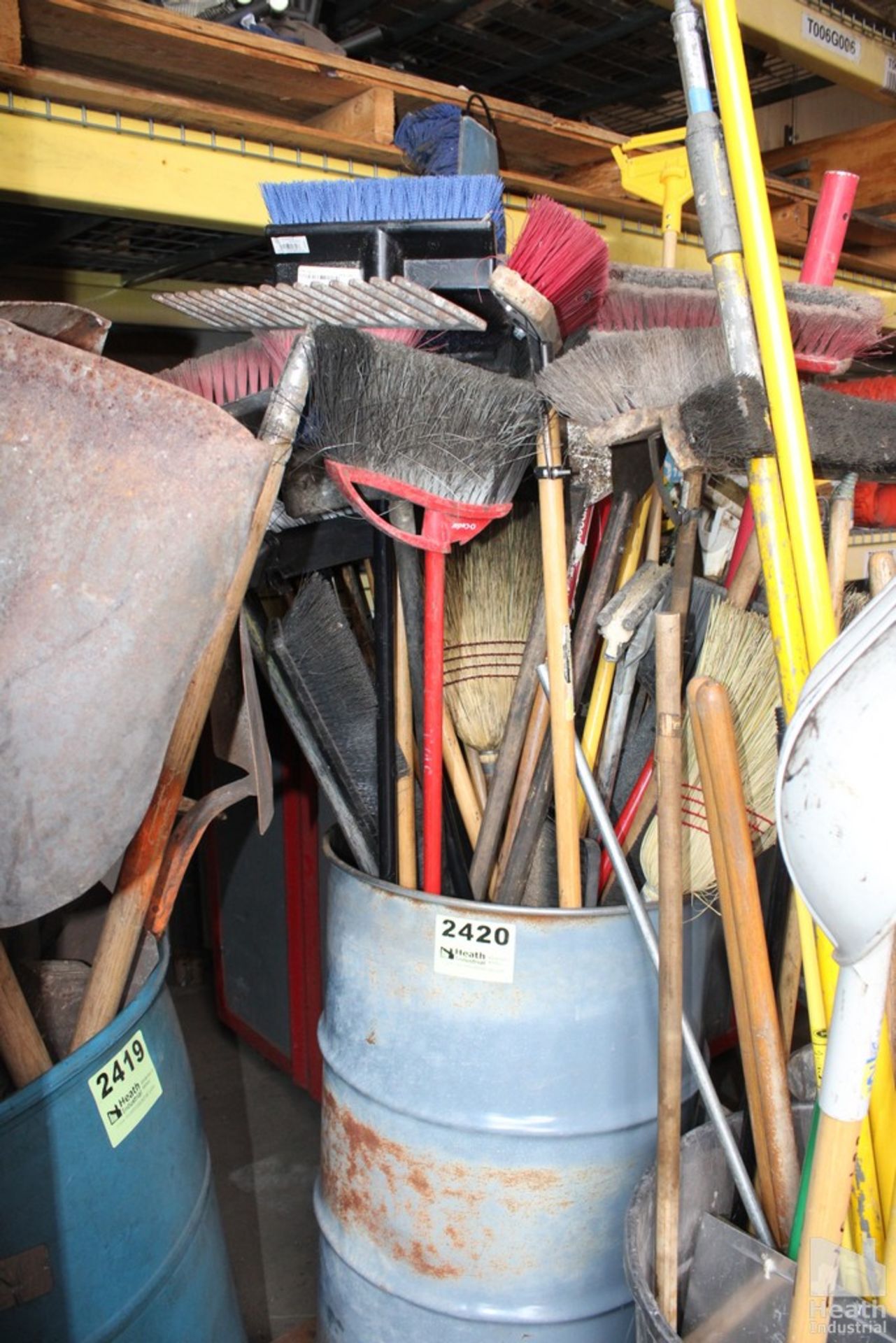 BARREL OF BROOMS, SQUEEGEES AND HANDLES